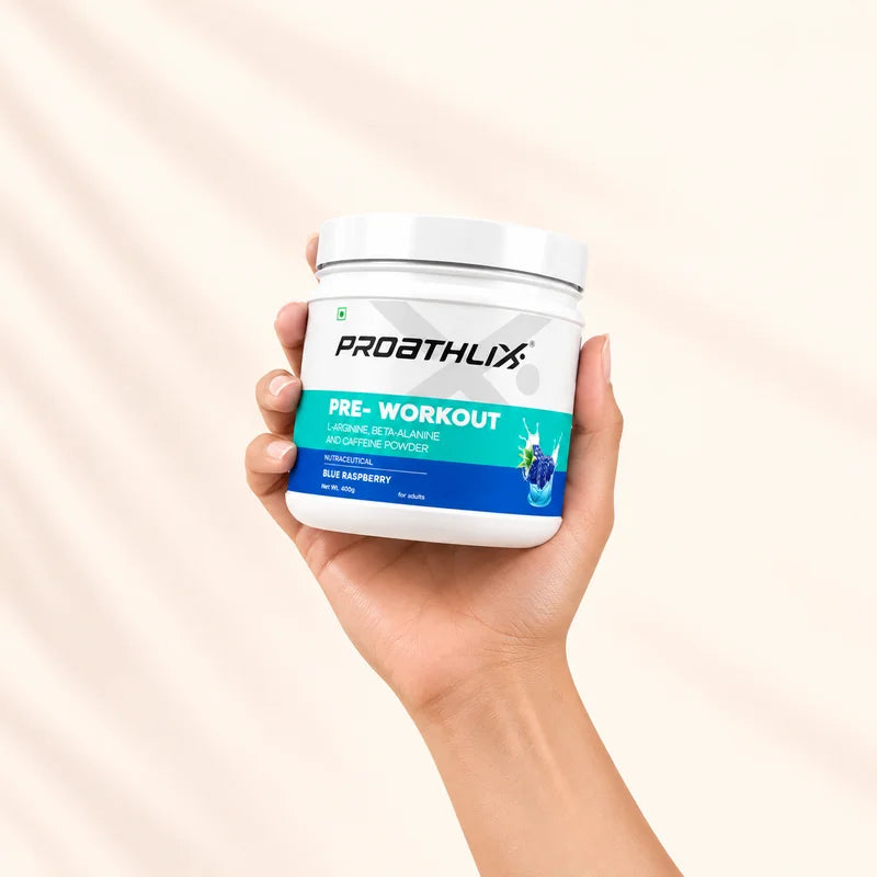 Proathlix Pre-Workout supplement Blue Raspberry flavor held in hand for workout energy and performance